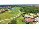 Single-Gathering home overlooking the golf course features a screened lanai for outdoor enjoyment at 102 Mestre Pl, North Venice, FL 34275