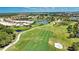 A home overlooks the golf course and the community's water feature, which provides a beautiful view at 102 Mestre Pl, North Venice, FL 34275