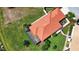 This single-Gathering home boasts a red tile roof, a screened lanai, and lush landscaping in its backyard at 102 Mestre Pl, North Venice, FL 34275