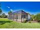 The screen enclosed patio with lush landscaping enhances this lovely backyard at 102 Mestre Pl, North Venice, FL 34275