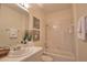 Cozy bathroom with shower-tub combo and stylish vanity at 102 Mestre Pl, North Venice, FL 34275