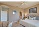 Comfortable bedroom featuring neutral paint, a king bed, and ensuite bathroom access for seamless living at 102 Mestre Pl, North Venice, FL 34275