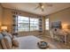 Inviting bedroom with large windows, a comfortable bed, and bright, natural light for a relaxing retreat at 102 Mestre Pl, North Venice, FL 34275