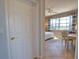 This bedroom features tile flooring, a window with views, and a ceiling fan to keep you cool and comfortable at 102 Mestre Pl, North Venice, FL 34275