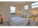 This bright, comfortable bedroom offers a serene space with large windows and cozy decor at 102 Mestre Pl, North Venice, FL 34275