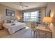 Relaxing bedroom featuring a king bed, bright window views and coastal decor for a serene living experience at 102 Mestre Pl, North Venice, FL 34275