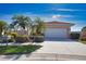 Charming home showcasing a well-manicured lawn, mature palm trees, and a pristine two-car garage at 102 Mestre Pl, North Venice, FL 34275