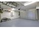 Spacious two-car garage with ample storage space and a painted floor at 102 Mestre Pl, North Venice, FL 34275