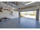 Open garage showcasing its spacious interior and access to the driveway at 102 Mestre Pl, North Venice, FL 34275