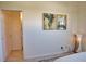 Hallway with an open door showcasing neutral wall paint at 102 Mestre Pl, North Venice, FL 34275