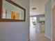 Inviting interior view showcasing a tiled hallway leading to the living area and kitchen at 102 Mestre Pl, North Venice, FL 34275