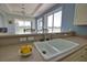 Kitchen sink with a view of the backyard and an eat-in breakfast bar at 102 Mestre Pl, North Venice, FL 34275