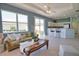 Open living space with tile floors, a ceiling fan, and access to the kitchen at 102 Mestre Pl, North Venice, FL 34275