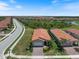 Stunning aerial view of the property with lush landscaping and a serene community setting at 10209 Fiddlewood Dr, Venice, FL 34293