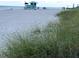 Scenic beach view featuring a lifeguard stand and the beautiful ocean in the background at 10209 Fiddlewood Dr, Venice, FL 34293
