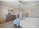 Bedroom featuring a gray dresser and closet with neutral colored walls at 10209 Fiddlewood Dr, Venice, FL 34293