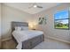 Comfortable bedroom has a large window that provides ample natural light at 10209 Fiddlewood Dr, Venice, FL 34293