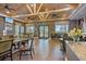 Clubhouse with tables, chairs, and ample seating for residents, plus a view of outside at 10209 Fiddlewood Dr, Venice, FL 34293