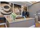 Resident coffee bar featuring granite counters, coffee-themed murals, and modern coffee machines at 10209 Fiddlewood Dr, Venice, FL 34293
