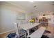 Bright dining area featuring a modern table and bench, complemented by stylish decor and an open layout at 10209 Fiddlewood Dr, Venice, FL 34293