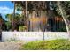 Manasota Beach welcome sign at the entrance, surrounded by lush greenery and palm trees at 10209 Fiddlewood Dr, Venice, FL 34293