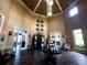 Elegant lobby area with decorative accents, tiled floors, and access to dining and lounge areas at 10209 Fiddlewood Dr, Venice, FL 34293