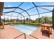 Private screened-in pool with brick patio perfect for outdoor relaxation and entertaining at 10209 Fiddlewood Dr, Venice, FL 34293