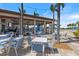 Enjoy outdoor dining at the community poolside bar and seating area under romantic string lights at 10209 Fiddlewood Dr, Venice, FL 34293