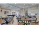 Spacious community room with tables, chairs, and a billiard table at 10410 Inglenook Ter, Palmetto, FL 34221