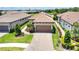 Charming single-Gathering home with a well-manicured lawn and a brick driveway, adding to its curb appeal at 10410 Inglenook Ter, Palmetto, FL 34221