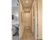 Hallway with views to multiple rooms with consistent flooring at 10410 Inglenook Ter, Palmetto, FL 34221