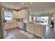 Well-lit kitchen featuring sleek countertops, modern appliances, and an open design concept into the living area at 10410 Inglenook Ter, Palmetto, FL 34221