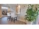 Modern kitchen with white chairs at the breakfast bar, stainless steel appliances, and recessed lighting at 10410 Inglenook Ter, Palmetto, FL 34221