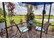 Delightful lanai showcases a cozy outdoor sitting area and gorgeous views of the peaceful backyard with the pond at 10410 Inglenook Ter, Palmetto, FL 34221