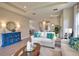 Well-lit living room with tile floors, neutral walls, modern decor, and comfortable seating area at 10410 Inglenook Ter, Palmetto, FL 34221