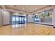 Empty bright yoga studio with hardwood floors, full mirrors, and light-filled windows at 10410 Inglenook Ter, Palmetto, FL 34221