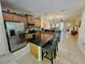 Bright kitchen with island, stainless appliances, and open layout to the living areas at 10930 Lerwick Cir, Englewood, FL 34223