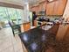 Well-equipped kitchen with granite countertops, stainless steel appliances, and ample cabinet space at 10930 Lerwick Cir, Englewood, FL 34223