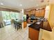 Spacious kitchen features stainless steel appliances, granite countertops, and a large island with seating at 10930 Lerwick Cir, Englewood, FL 34223
