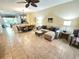 Open-concept living area flows into the kitchen and dining space, perfect for entertaining at 10930 Lerwick Cir, Englewood, FL 34223