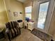 Cozy office space near the entrance, with a work desk, a chair and good natural light at 10930 Lerwick Cir, Englewood, FL 34223