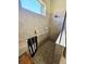 Tiled walk-in shower with accessible features, including a grab bar and seating at 10930 Lerwick Cir, Englewood, FL 34223