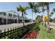 Picturesque street view with vibrant storefronts, lush landscaping, and pedestrian-friendly sidewalks at 10930 Lerwick Cir, Englewood, FL 34223