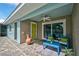 Charming backyard patio with colorful decor and comfortable seating area at 1099 Nokomis S Ave, Venice, FL 34285