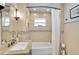 Elegant bathroom featuring tile walls, a granite countertop, and a bathtub with a shower at 1099 Nokomis S Ave, Venice, FL 34285