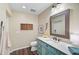 Charming bathroom with a custom vanity and a decorative mirror at 1099 Nokomis S Ave, Venice, FL 34285