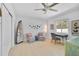 Inviting bedroom with a decorative shelf, a desk by the window, and comfortable seating at 1099 Nokomis S Ave, Venice, FL 34285
