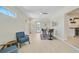 Bright and airy dining area is enhanced by modern lighting and a view to the yard at 1099 Nokomis S Ave, Venice, FL 34285