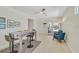 Eat-in kitchen with access to the backyard pool area, ceiling fan and bar seating at 1099 Nokomis S Ave, Venice, FL 34285