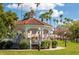 Charming gazebo in a park-like setting with palm trees and benches, perfect for relaxation and community events at 1099 Nokomis S Ave, Venice, FL 34285